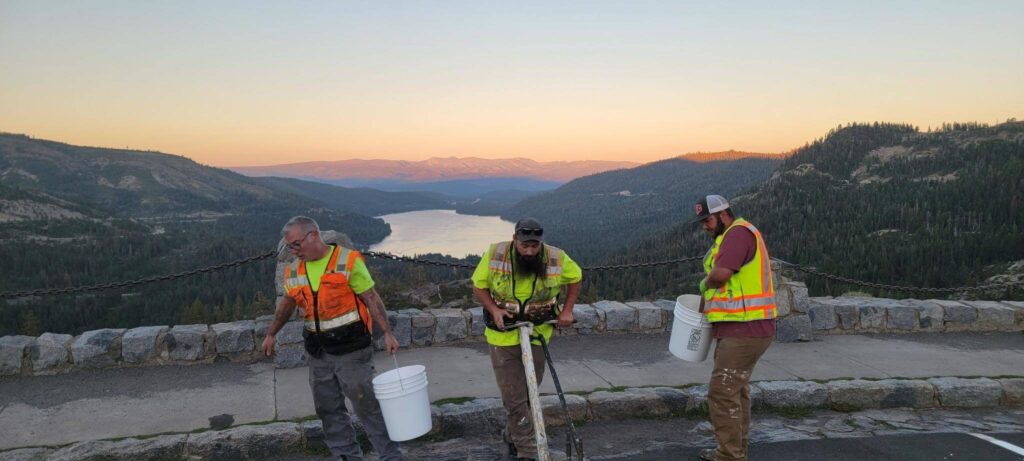 Teamwork in action during a pavement striping job